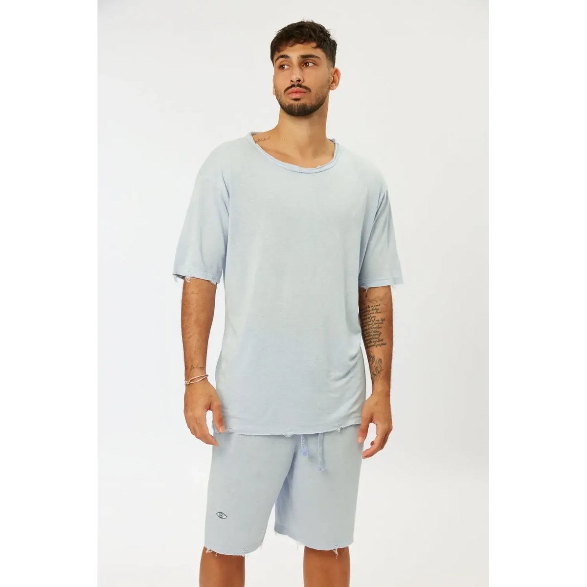 Nicki Soft Open Top in light blue on a male model, paired with matching shorts