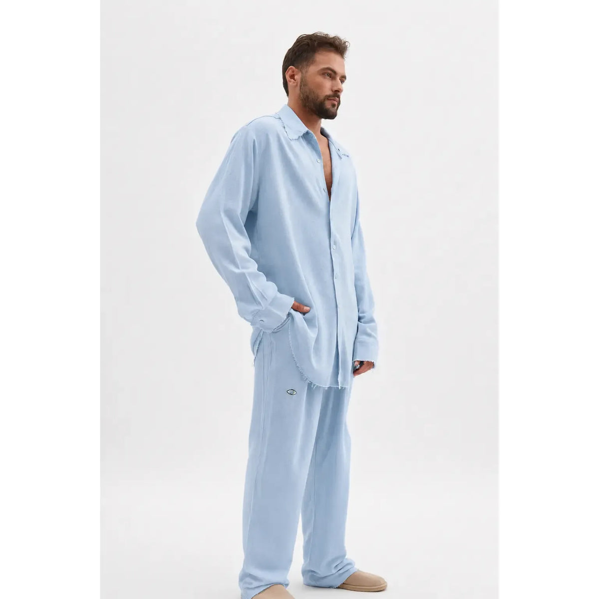 Man wearing a Soft Linen Long Sleeve Button-Up Shirt in Ice Blue with matching pants