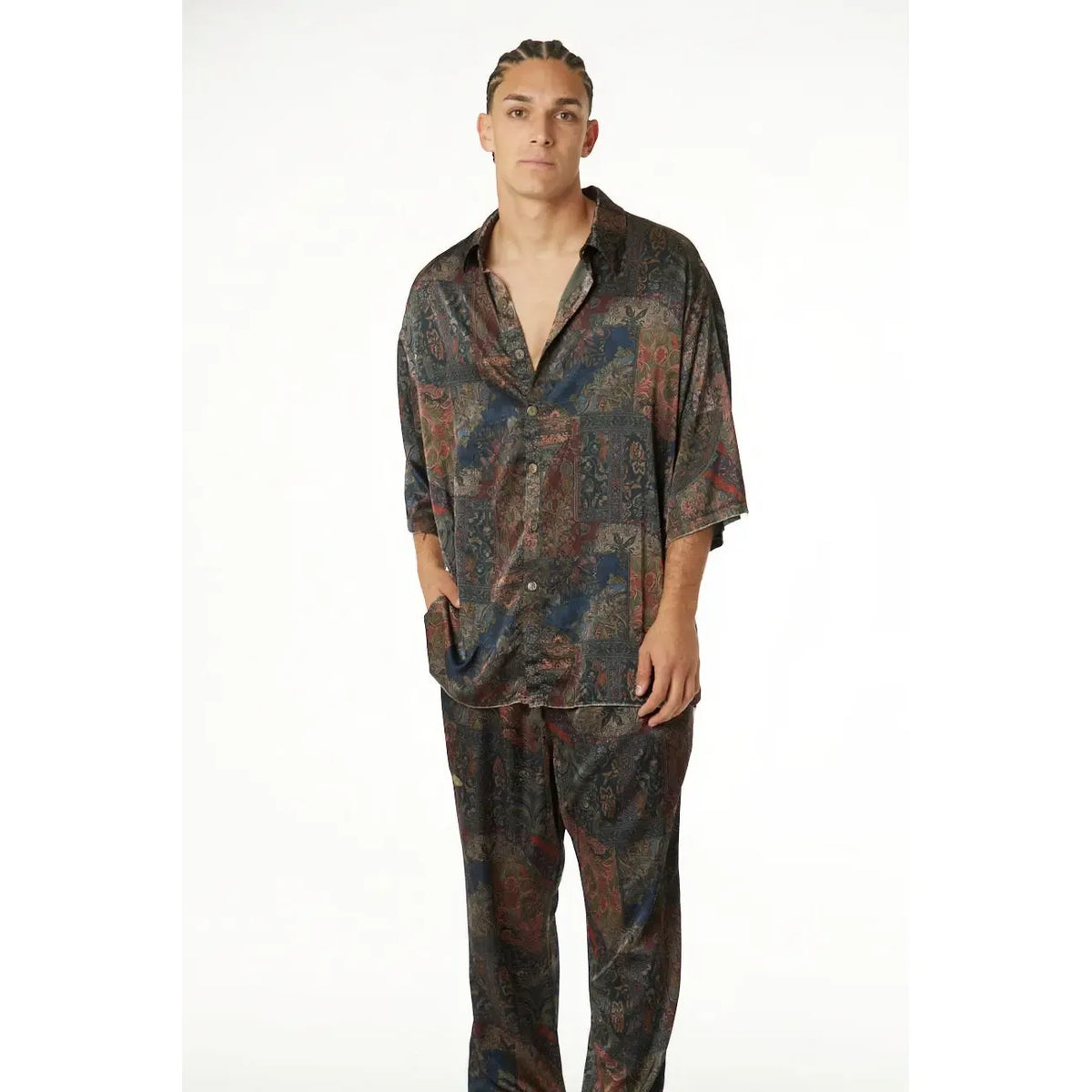 Man wearing Pure Satin Noir Pants and matching patterned shirt