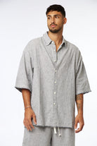 Striped Linen Short Sleeve Button-Up Shirt in black with matching shorts