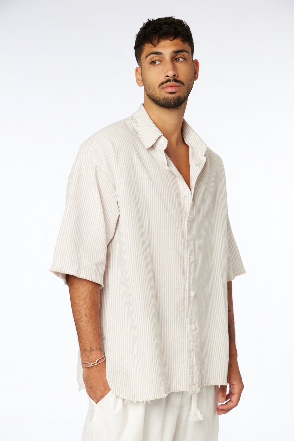 Man wearing a Striped Linen Short Sleeve Button-Up Shirt in Stone