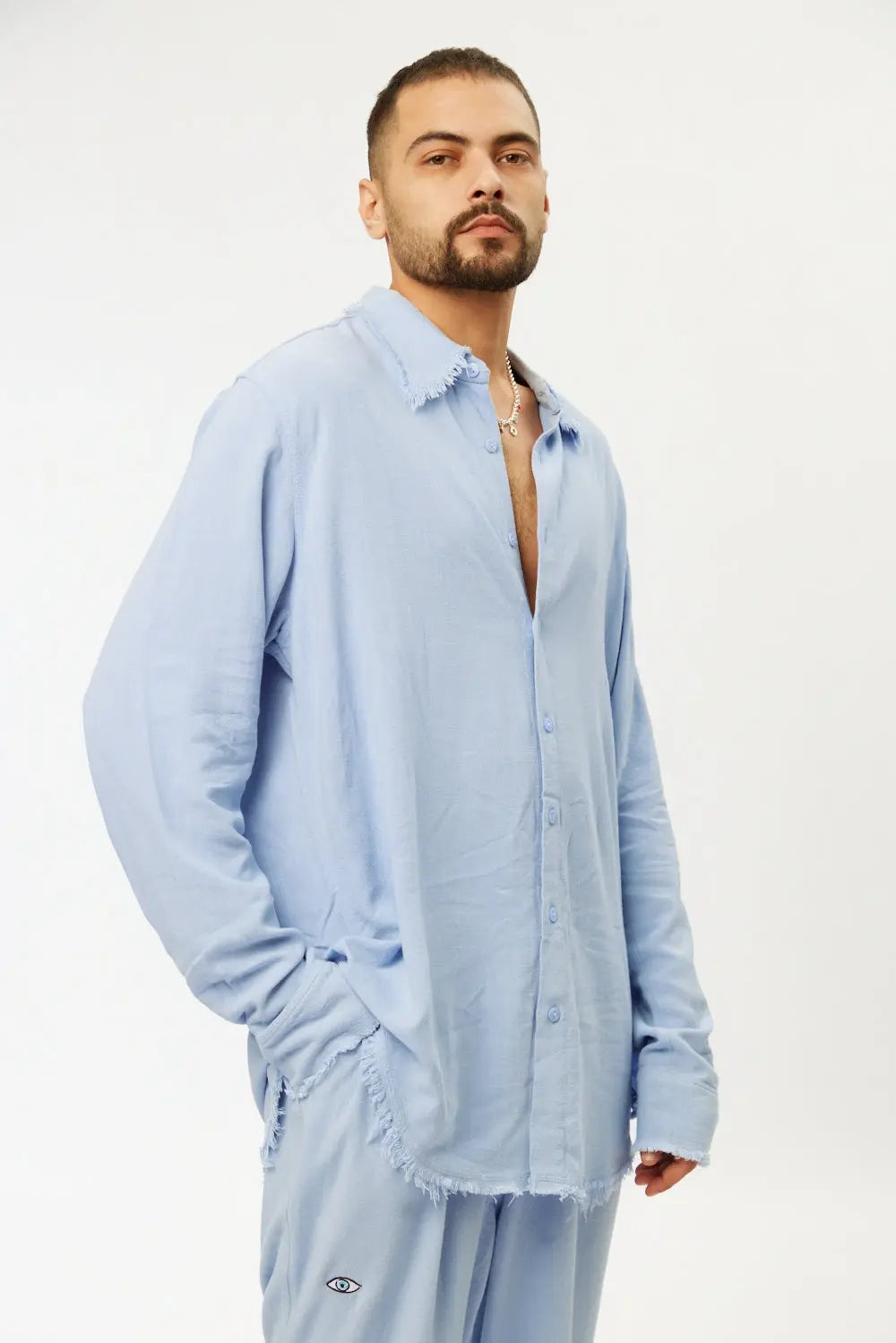 Man wearing a sky blue Soft Linen Set with long sleeve shirt and pants