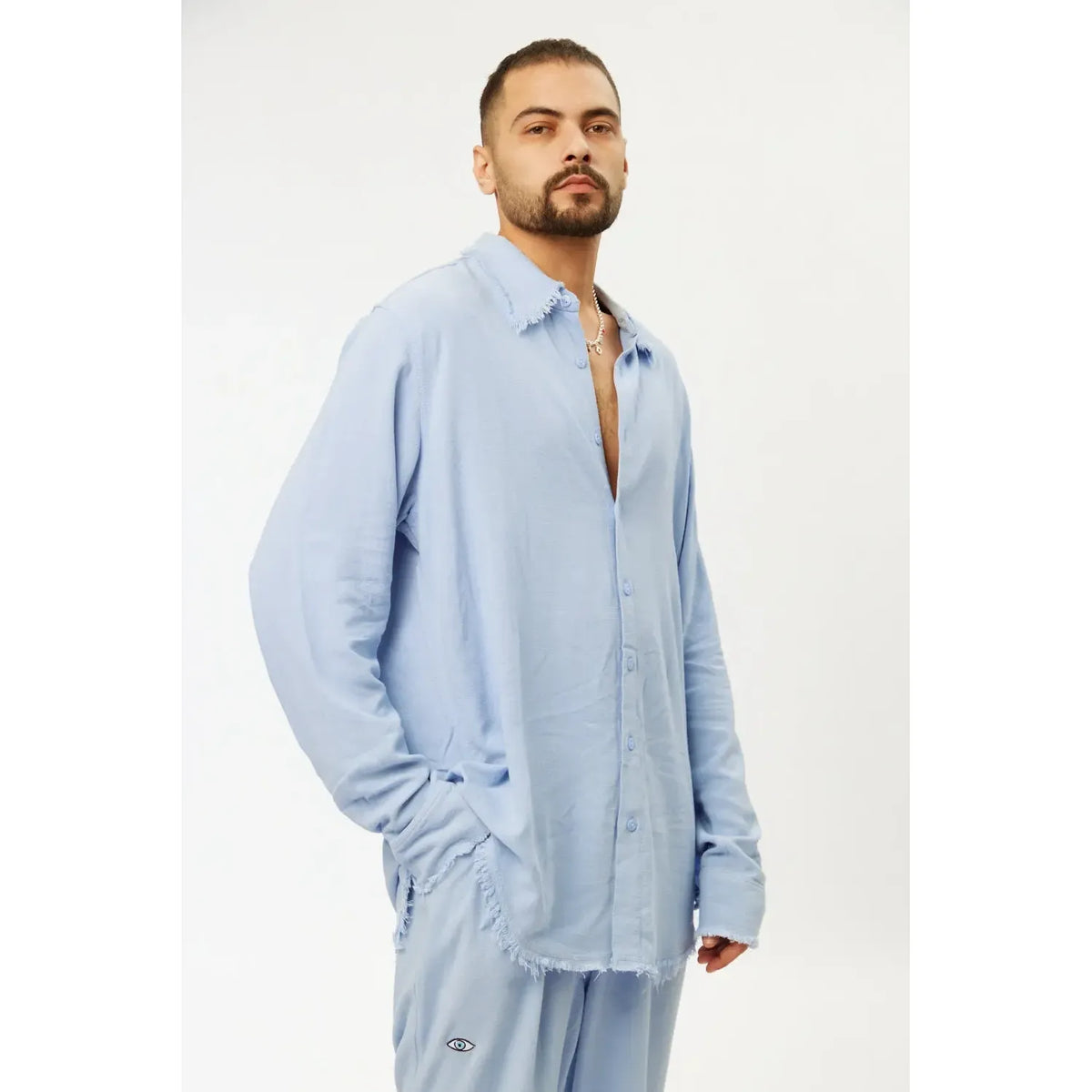 Man wearing a sky blue Soft Linen Set with long sleeve shirt and pants