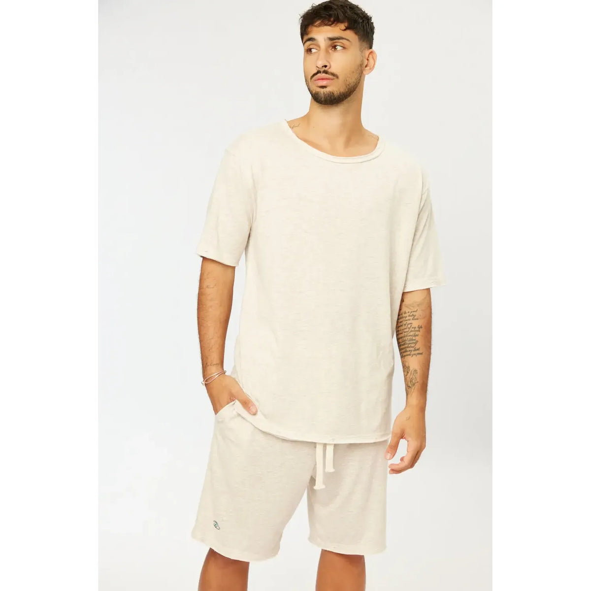 Man wearing Nicki Soft Open Top in melange stone with matching shorts