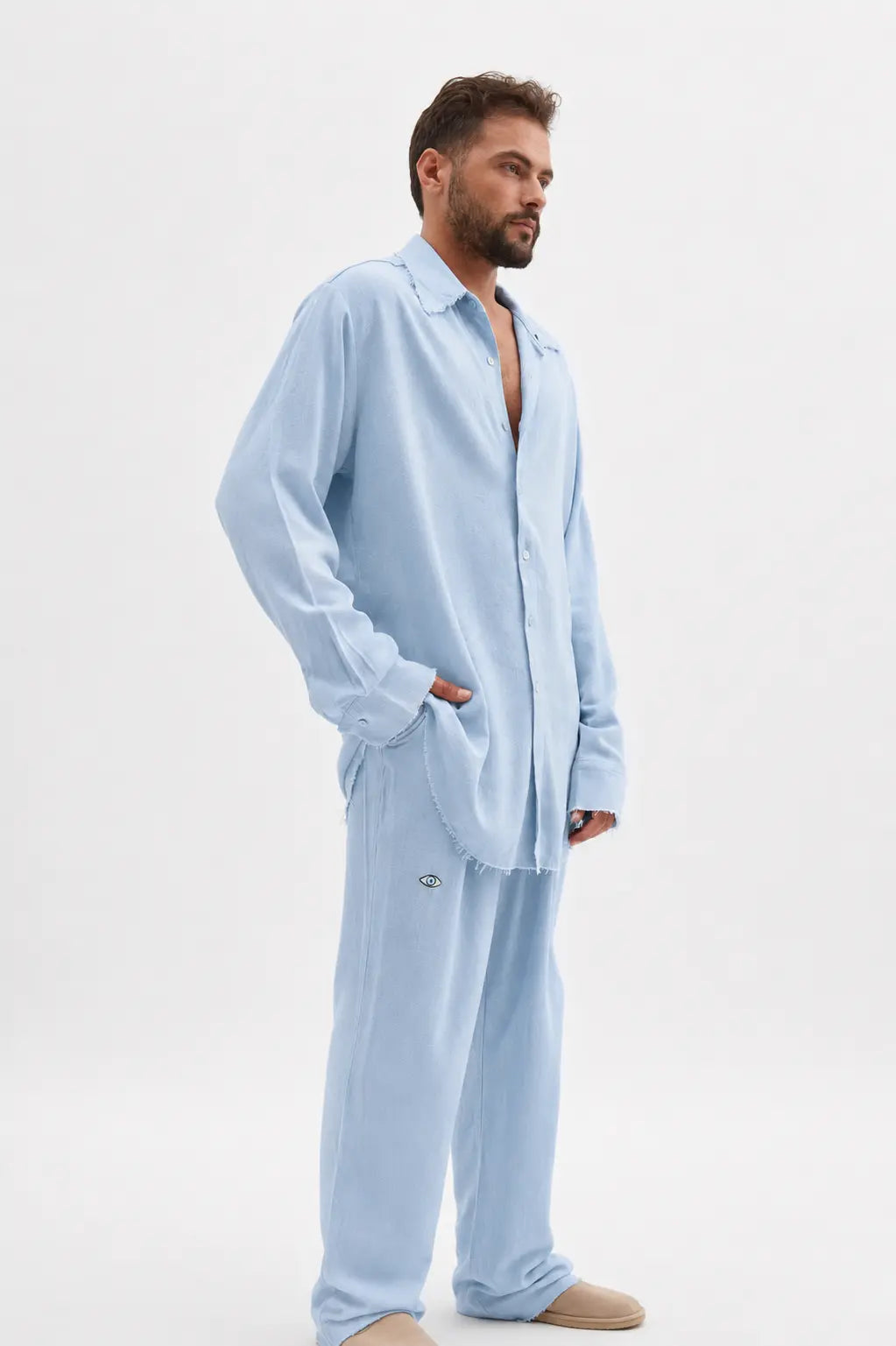 Man wearing a Soft Linen Long Sleeve Button-Up Shirt in Ice Blue with matching pants