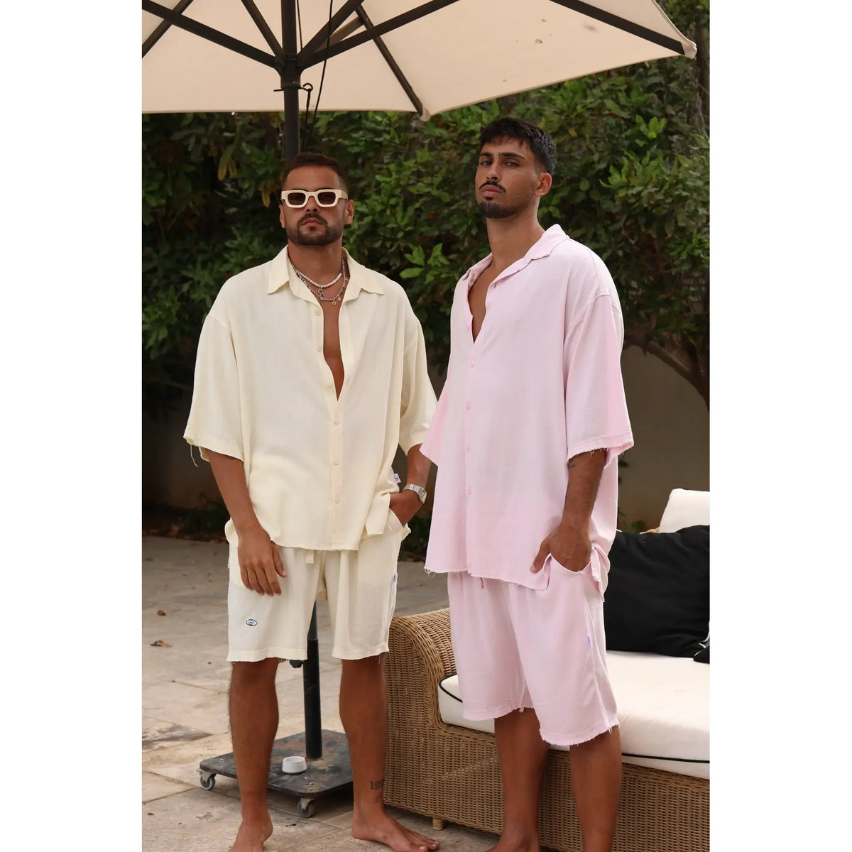 Two men wearing linen shirts and Soft Linen Bermuda Shorts in baby pink and cream