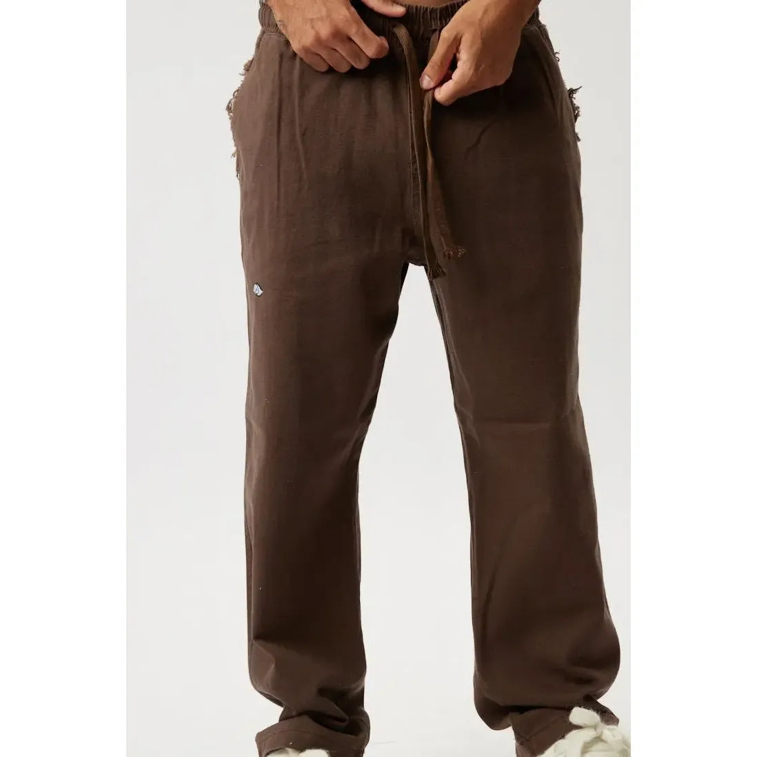DC SL Pants in brown with a drawstring waist and small blue logo on the left thigh