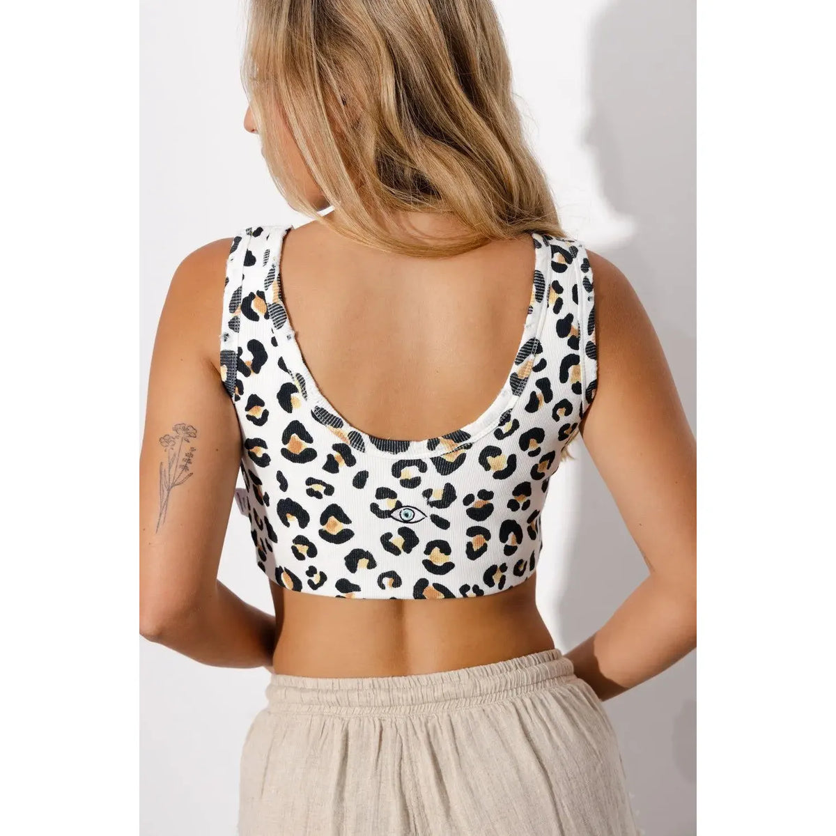 Essential Crop Top in white leopard print with an eye graphic on the back