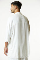 Soft Linen Short Sleeve Button-Up Shirt in Cream, back view with embroidered eye detail on the upper back