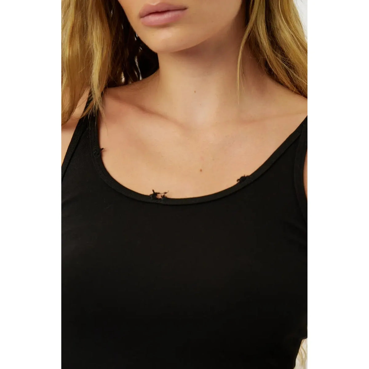 Close up of a woman wearing a black Slim Cotton Tank Top