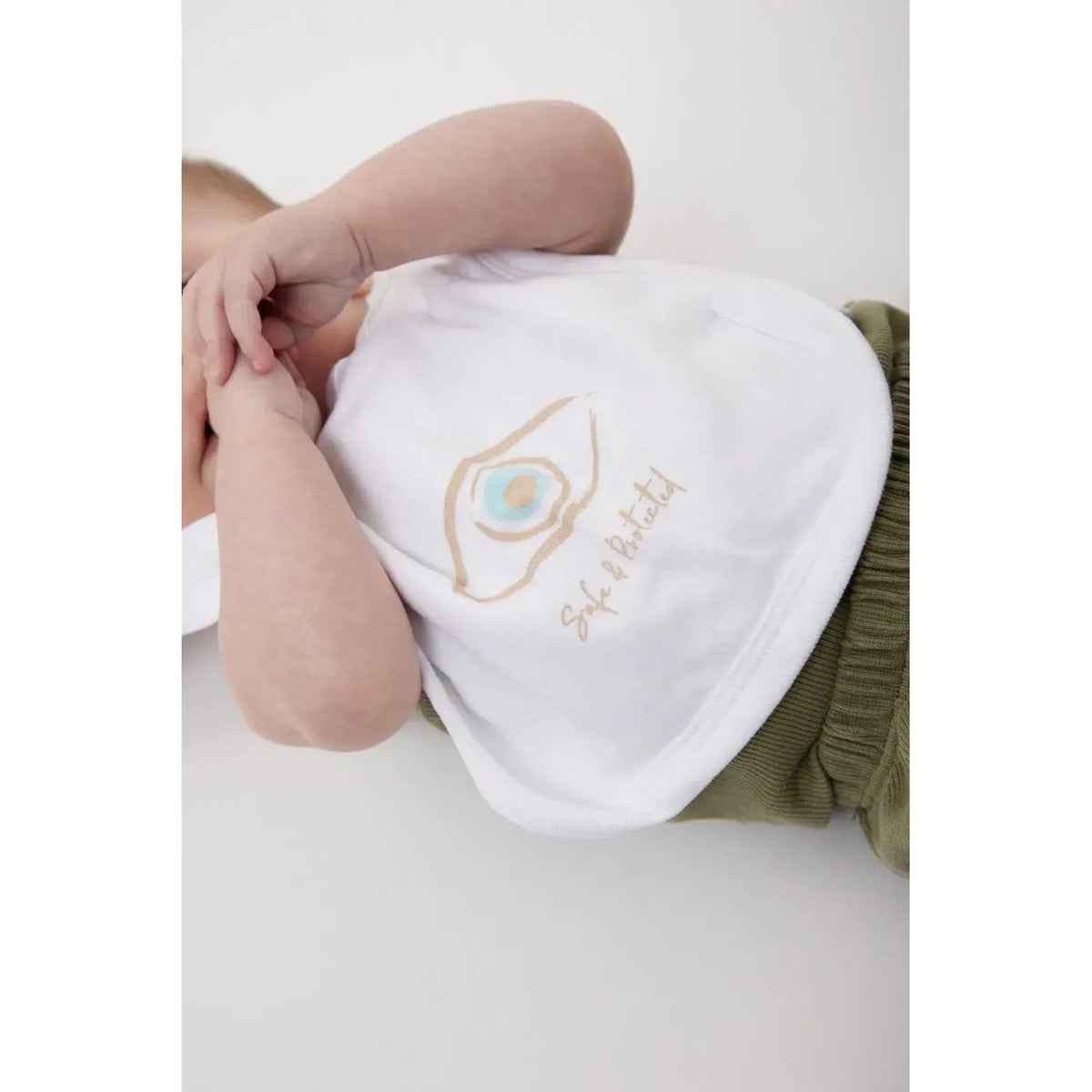 Newborn Cotton Bib with a graphic of an eye and the words Safe & Protected