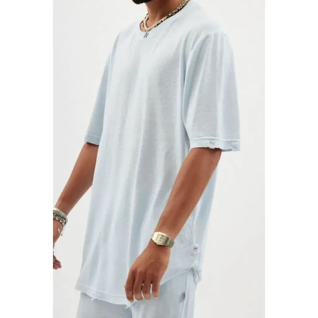 TFU Soft Essential Tee in sky blue, worn by a person with beaded necklaces and a watch