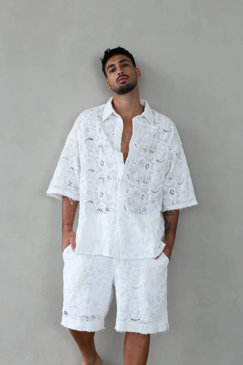 FLR Limited Set in white, short sleeve shirt and Bermuda shorts with lace pattern on a man